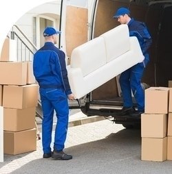 men taking couch and boxes out of moving truck